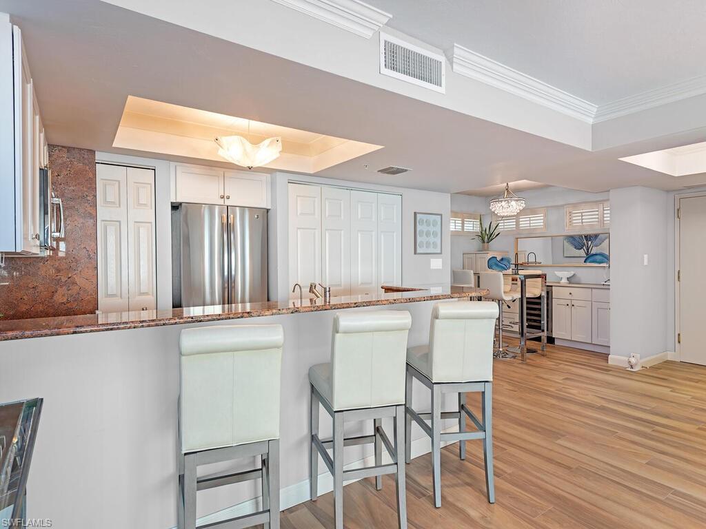 6849 Grenadier Boulevard, Unit 1803 Naples, FL 34108 - Photo 4 of 27 Extra counter seating