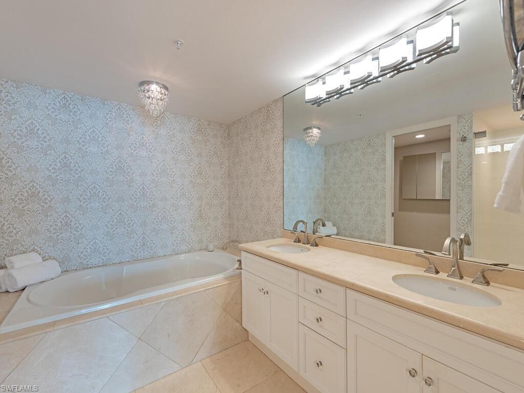 6849 Grenadier Boulevard, Unit 1803 Naples, FL 34108 - Photo 7 of 27 Owner's Bath with dual sinking and soaking tub