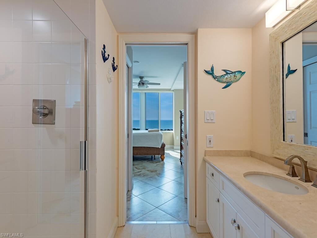 6849 Grenadier Boulevard, Unit 1803 Naples, FL 34108 - Photo 9 of 27 Guest Bedroom with Ensuite Bath