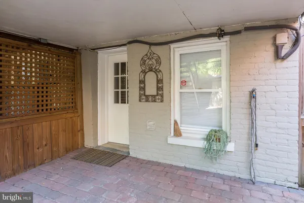 a view of entryway with a wooden door