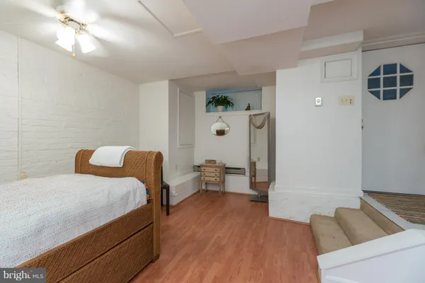 a bedroom with a bed and a couch