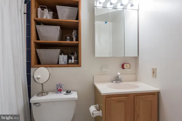 a bathroom with a toilet and a sink