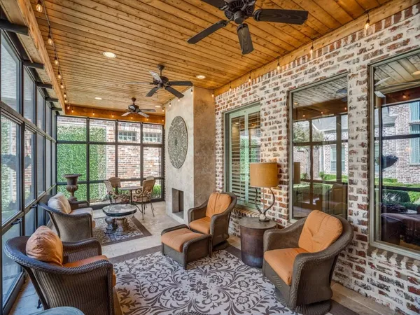 a balcony with furniture and a potted plant