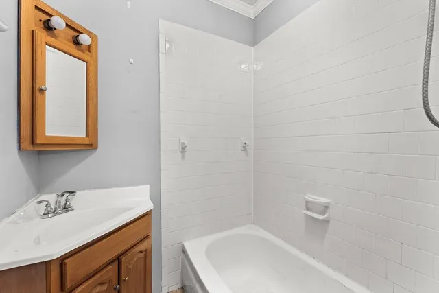 a bathroom with a sink and a bathtub