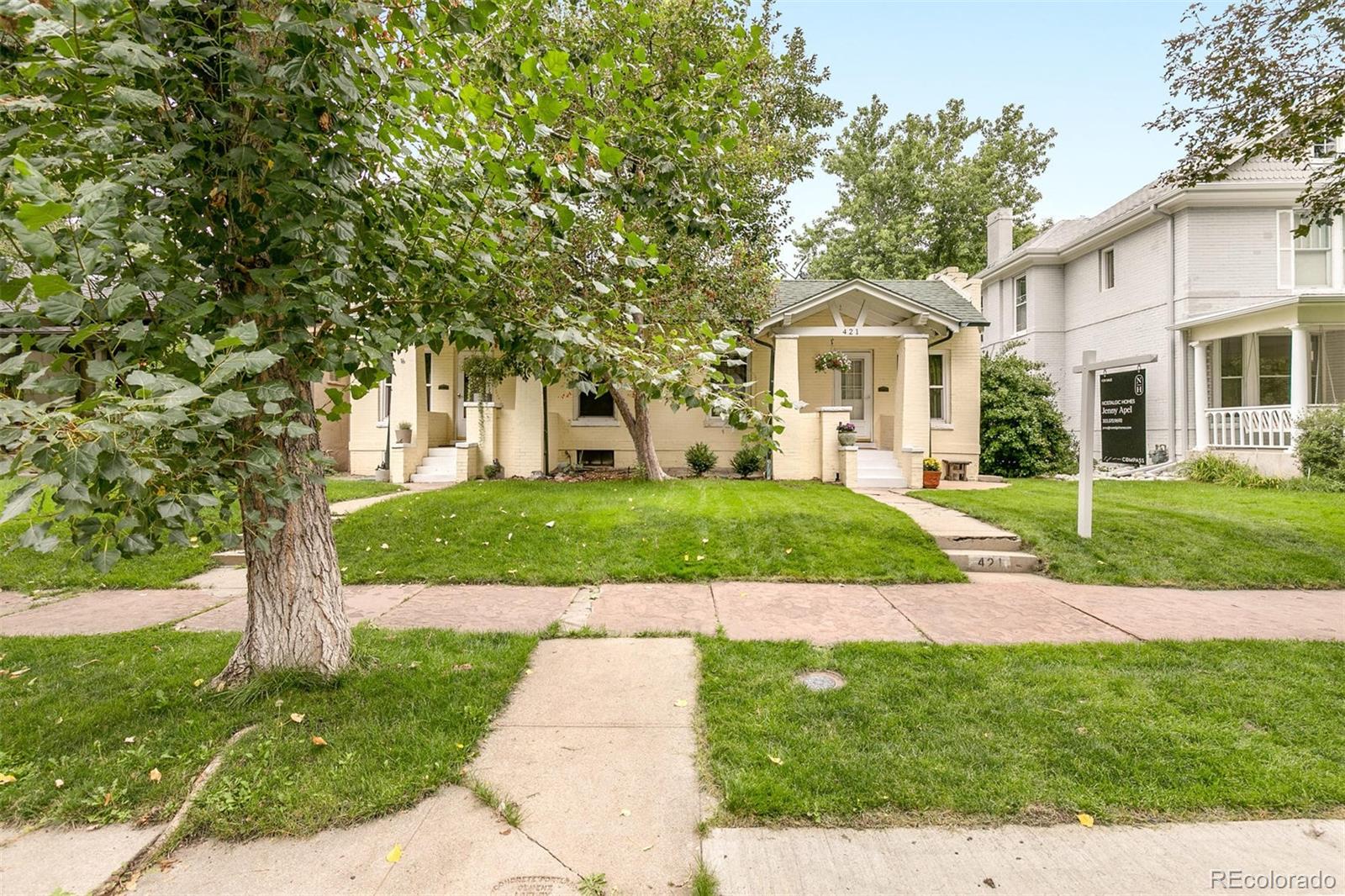 421 North Ogden Street Denver, CO 80218 - Photo 1 of 30 a front view of a house with a yard and trees