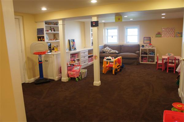 7 Pheasant Road Needham, MA 02492 - Photo 13 of 20 a living room with furniture and a flat screen tv