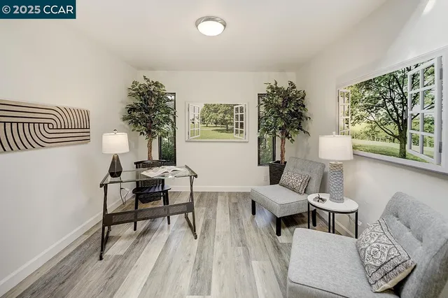 a living room with furniture and a table