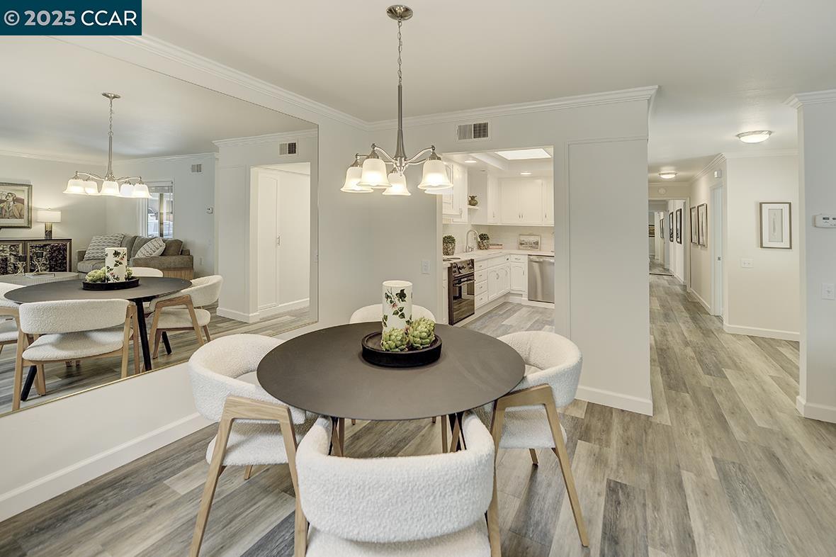 1315 Golden Rain Road, Unit 2 Walnut Creek, CA 94595 - Photo 15 of 54 a view of a dining room with furniture and wooden floor