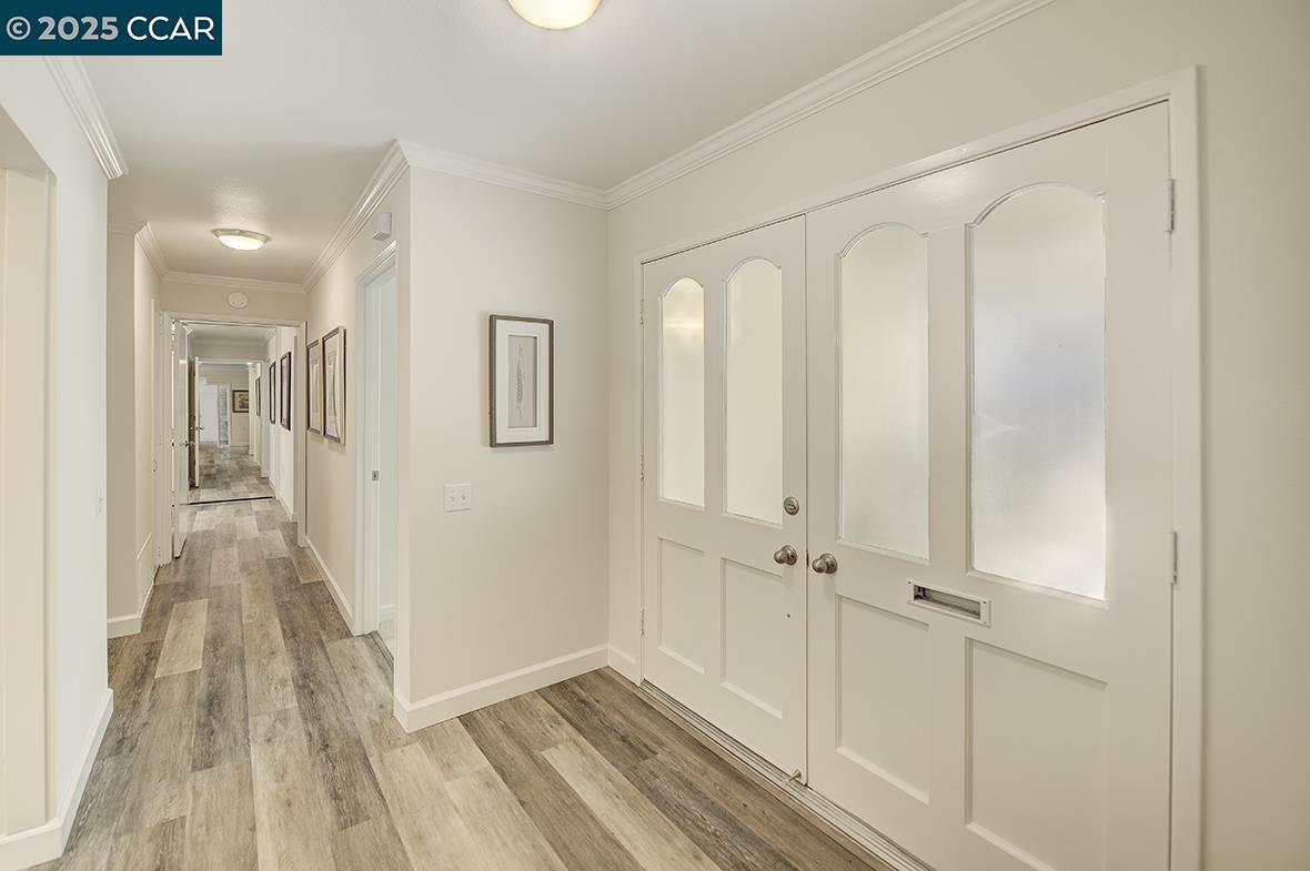 1315 Golden Rain Road, Unit 2 Walnut Creek, CA 94595 - Photo 22 of 54 a view of a hallway with wooden floor and staircase