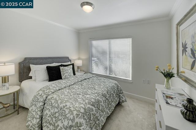 a bed room with a bed and a window