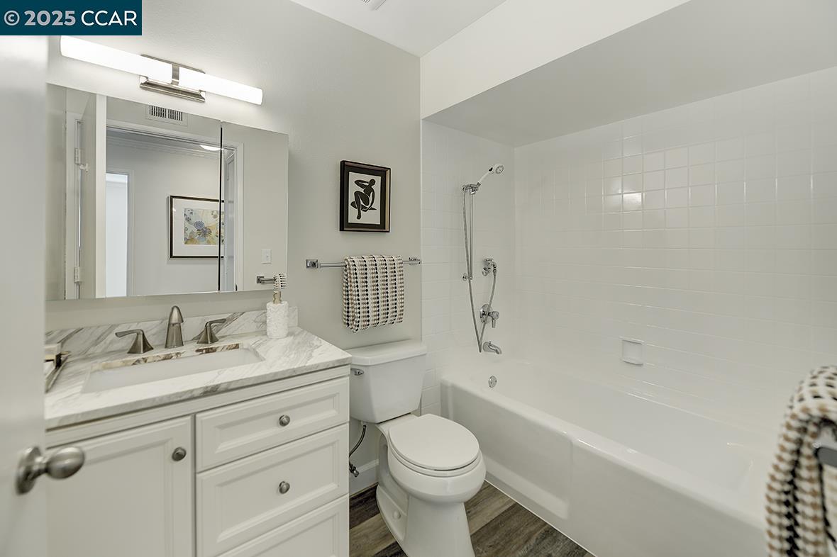 1315 Golden Rain Road, Unit 2 Walnut Creek, CA 94595 - Photo 27 of 54 a bathroom with a sink toilet tub and shower