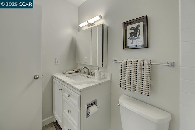 a bathroom with a sink mirror and a bath tub