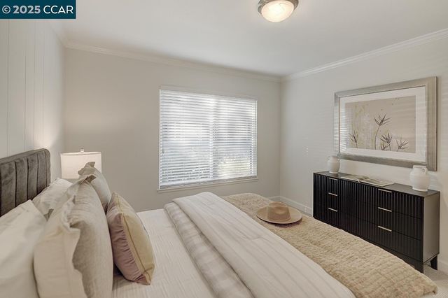 a bedroom with a bed and cabinet