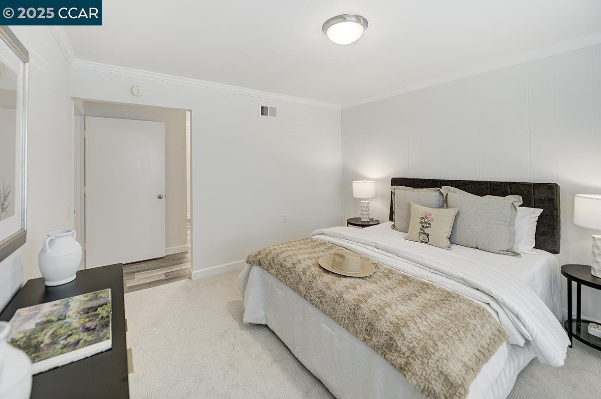 1315 Golden Rain Road, Unit 2 Walnut Creek, CA 94595 - Photo 33 of 54 a bedroom with a bed and a couch