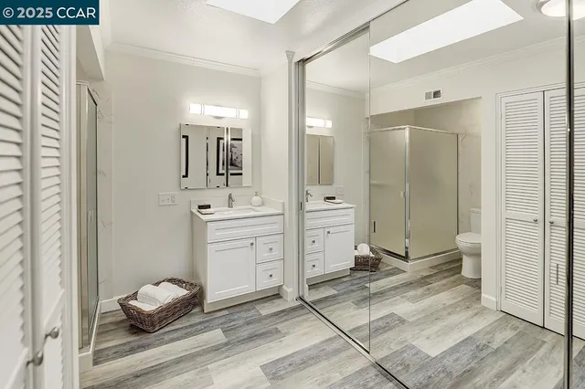 a bathroom with a sink toilet and a mirror