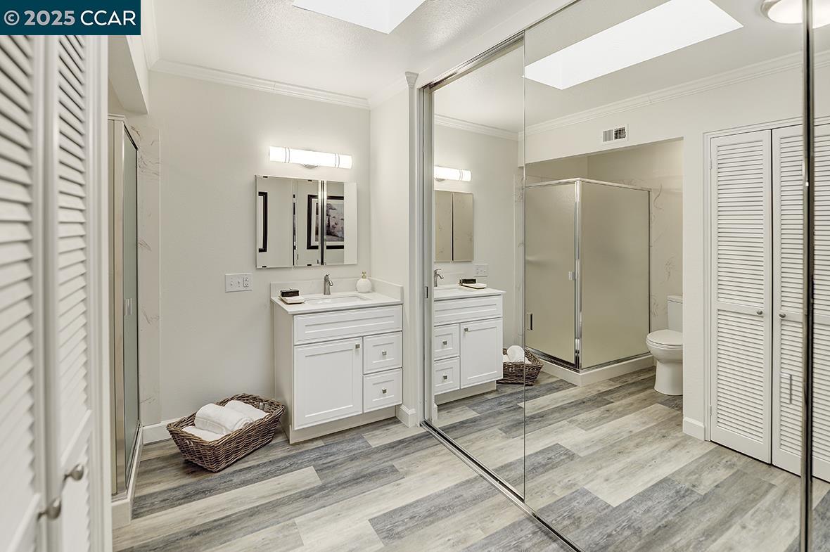 1315 Golden Rain Road, Unit 2 Walnut Creek, CA 94595 - Photo 34 of 54 a bathroom with a sink shower and a mirror