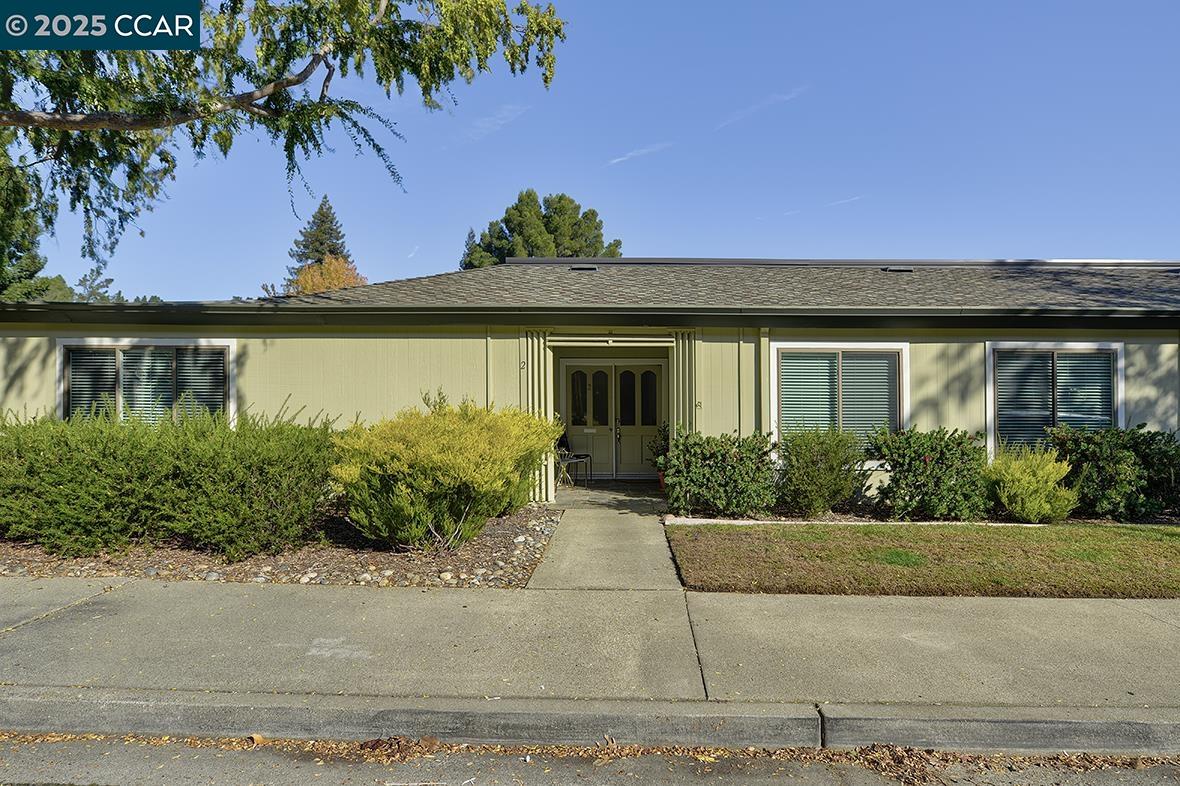 1315 Golden Rain Road, Unit 2 Walnut Creek, CA 94595 - Photo 38 of 54 a front view of a house with a garden