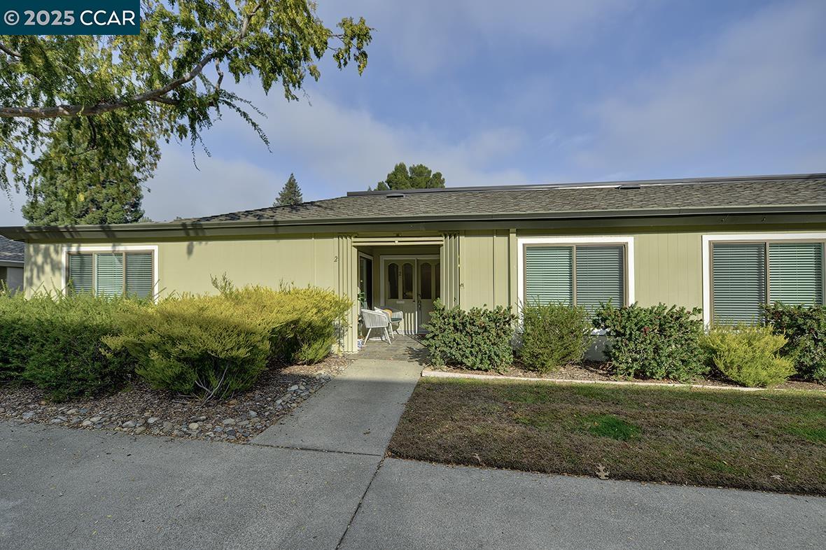 1315 Golden Rain Road, Unit 2 Walnut Creek, CA 94595 - Photo 39 of 54 a front view of a house with garden