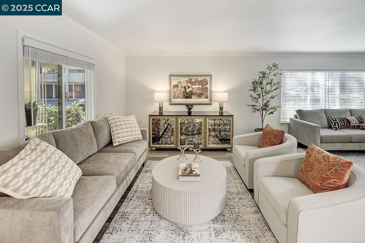 1315 Golden Rain Road, Unit 2 Walnut Creek, CA 94595 - Photo 4 of 54 a living room with furniture and a large window