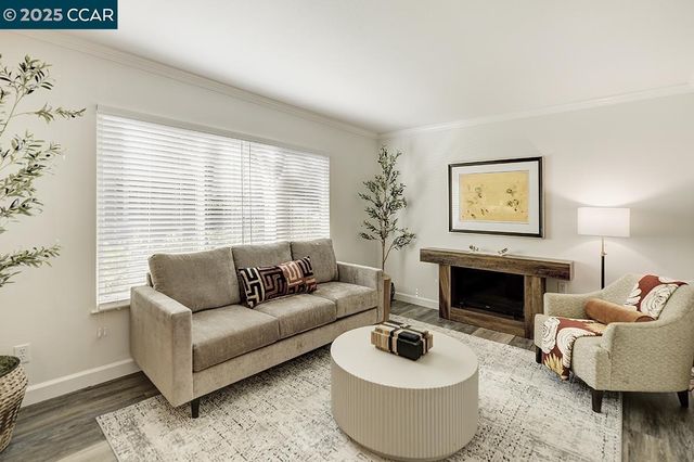 a living room with furniture and a table