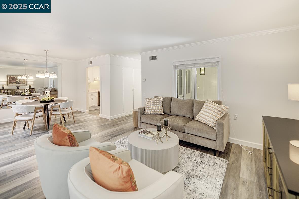1315 Golden Rain Road, Unit 2 Walnut Creek, CA 94595 - Photo 10 of 54 a living room with furniture and wooden floor