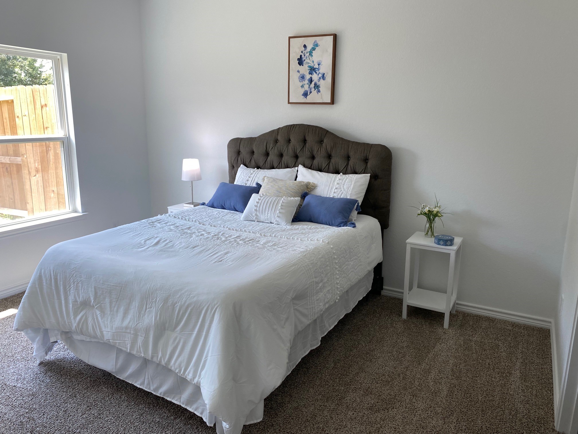 24029 Wildwood Road, Unit 23 Porter, TX 77365 - Photo 11 of 21 a bed sitting in a bedroom next to a window