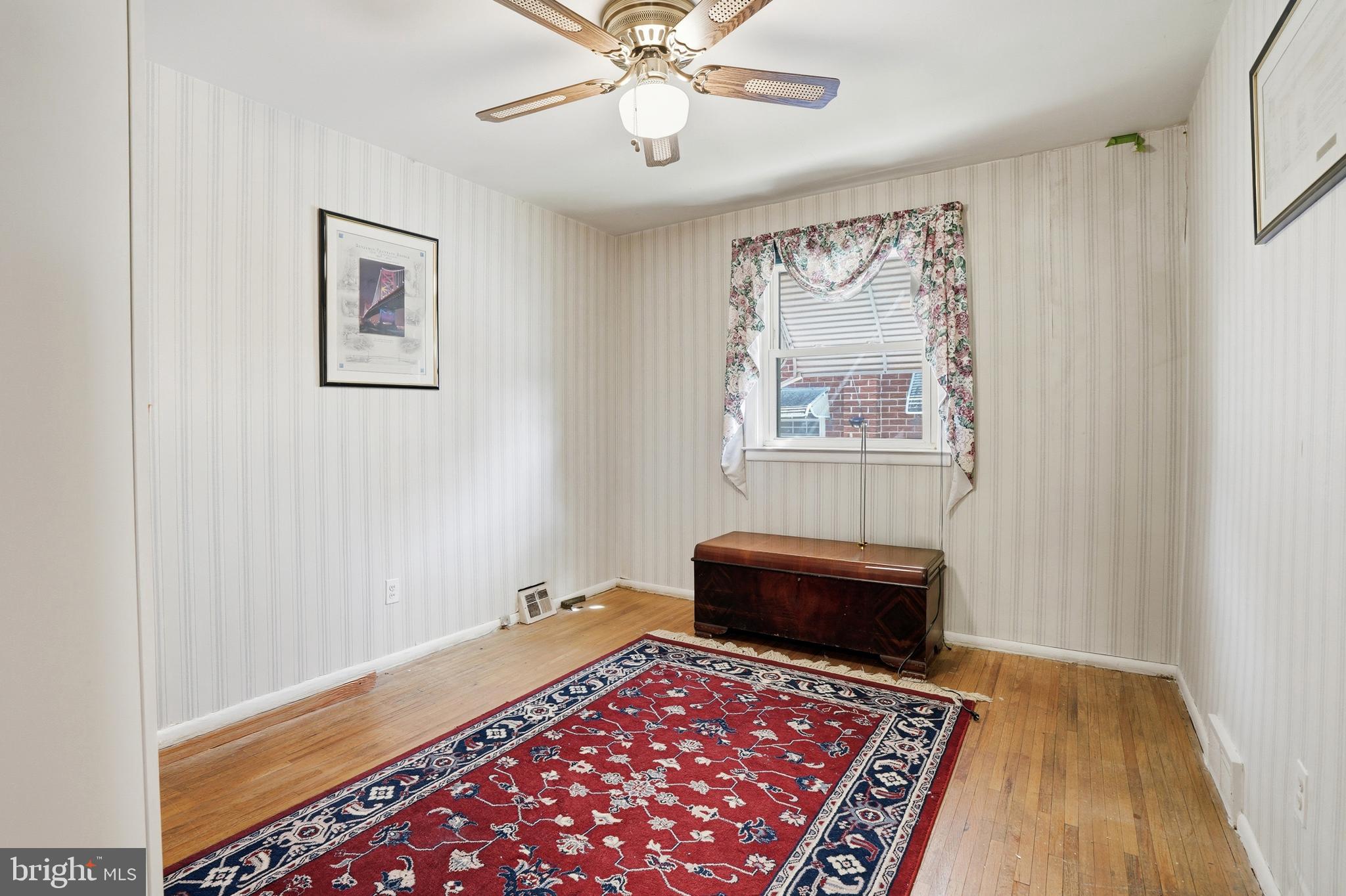8931 Leonard Street Philadelphia, PA 19152 - Photo 16 of 52 a view of a bedroom with furniture and wooden floor