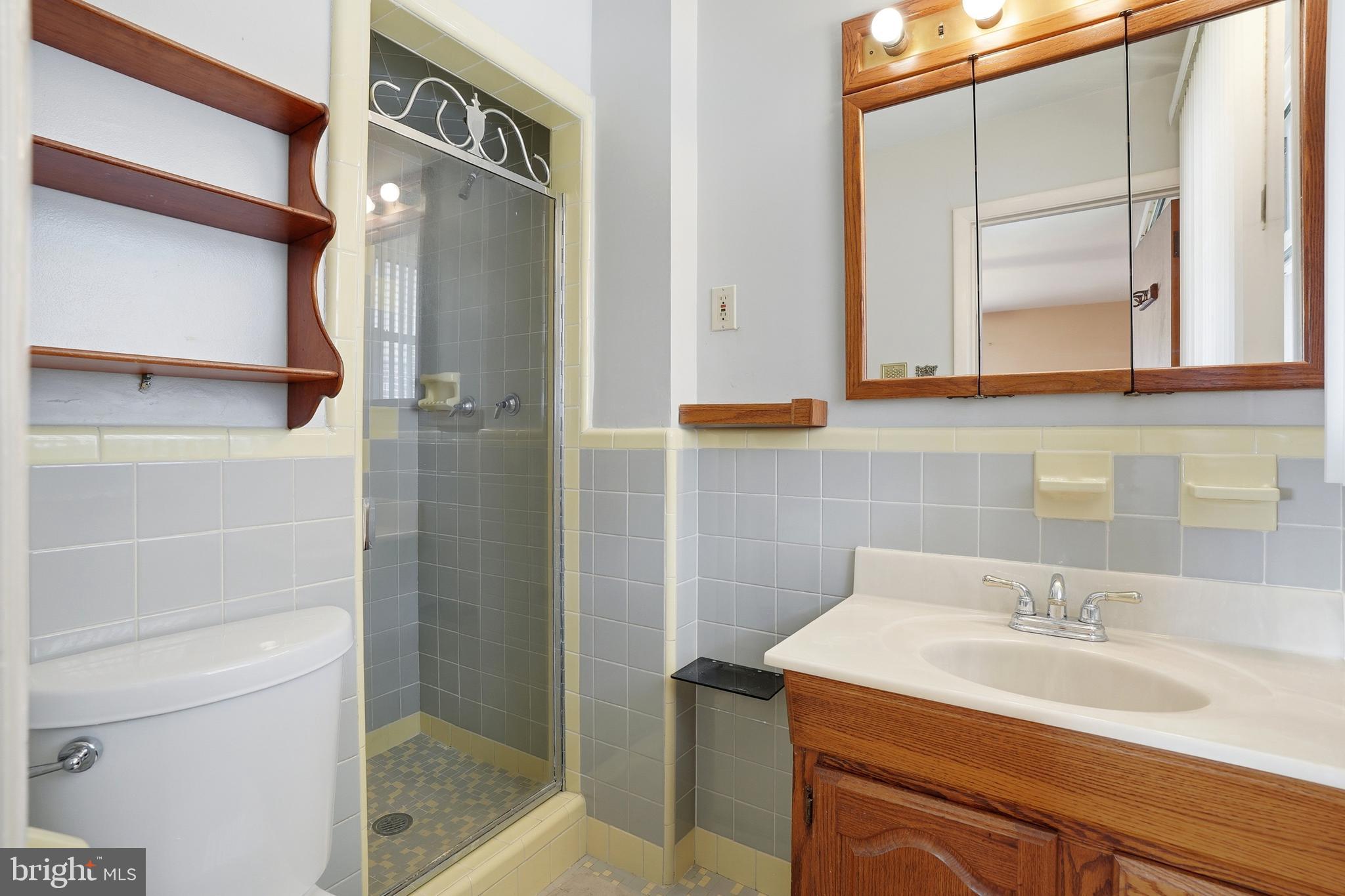 8931 Leonard Street Philadelphia, PA 19152 - Photo 22 of 52 a bathroom with a sink and a mirror