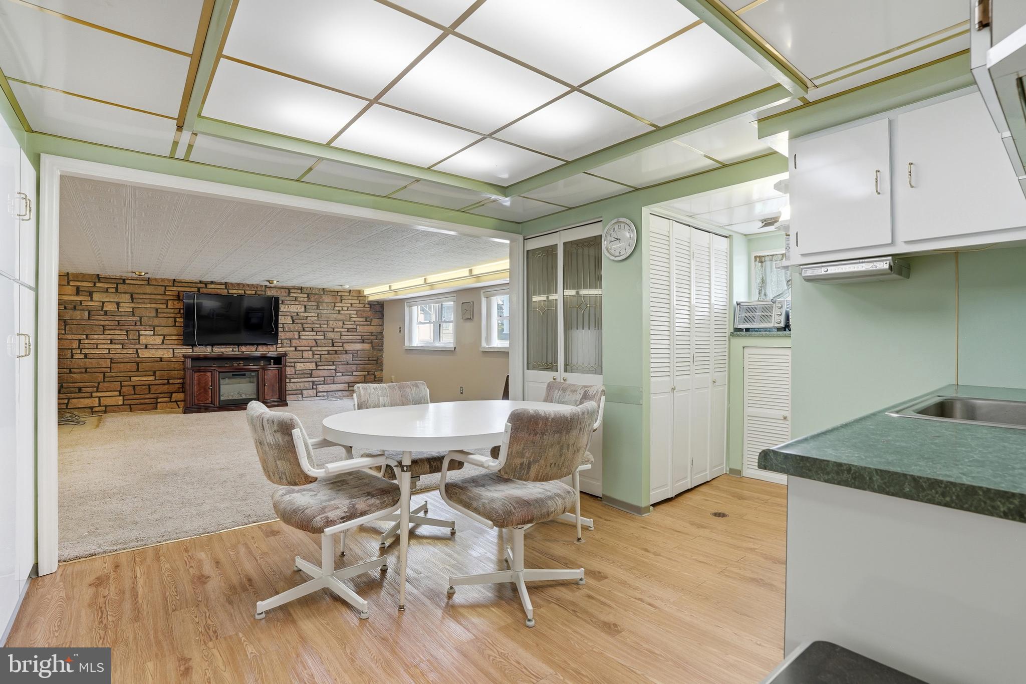 8931 Leonard Street Philadelphia, PA 19152 - Photo 31 of 52 a view of a dining room with furniture window and wooden floor