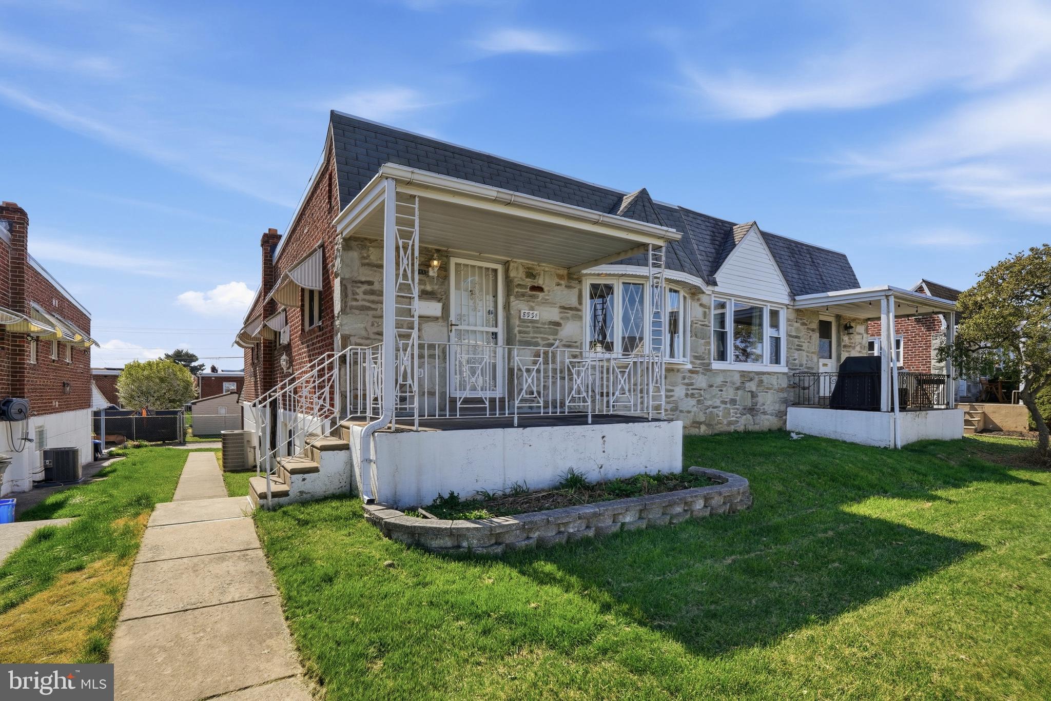 8931 Leonard Street Philadelphia, PA 19152 - Photo 4 of 52 a front view of a house with a yard