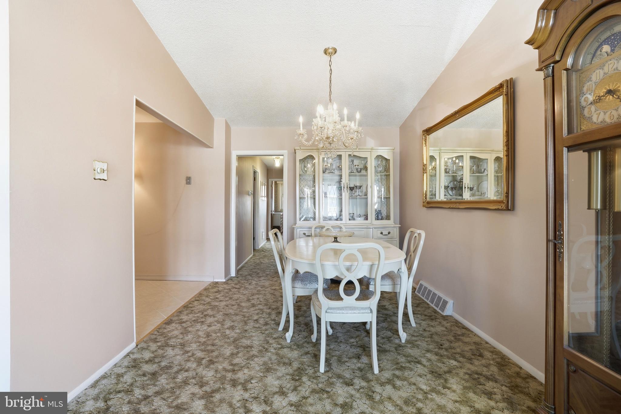 8931 Leonard Street Philadelphia, PA 19152 - Photo 9 of 52 a dining room with furniture a chandelier and window