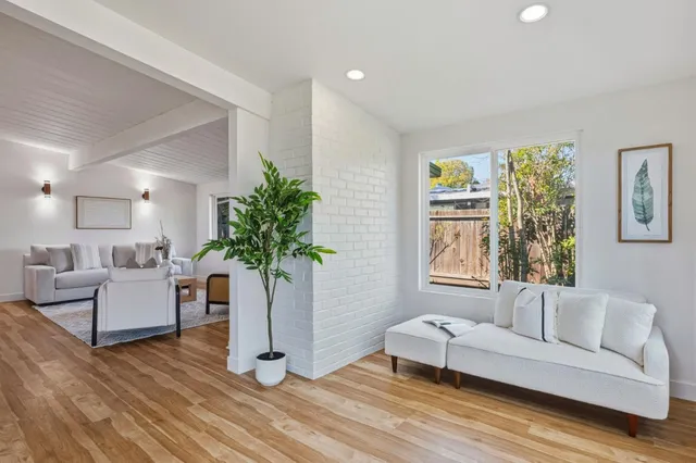 a bed room with a bed and a large window