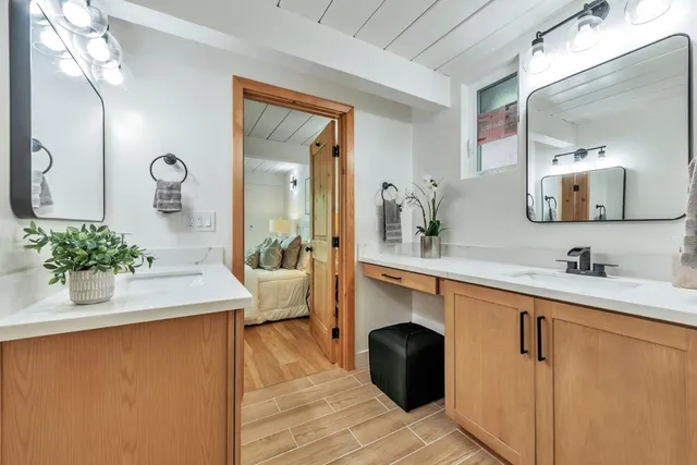 a kitchen with a table chairs and chandelier