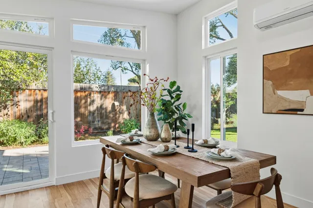 a view of a dining room with furniture window and outside view