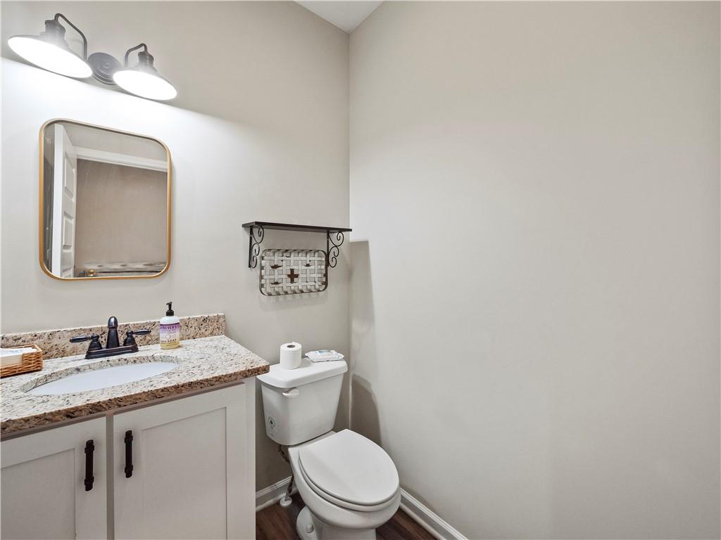259 Cochran Road Talmo, GA 30575 - Photo 15 of 35 a bathroom with a toilet a sink and mirror