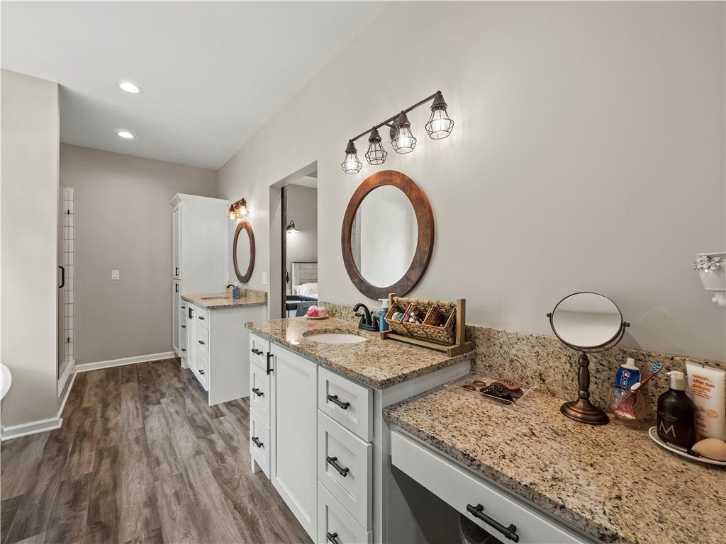 259 Cochran Road Talmo, GA 30575 - Photo 20 of 35 a kitchen with a sink a stove and a wooden floor