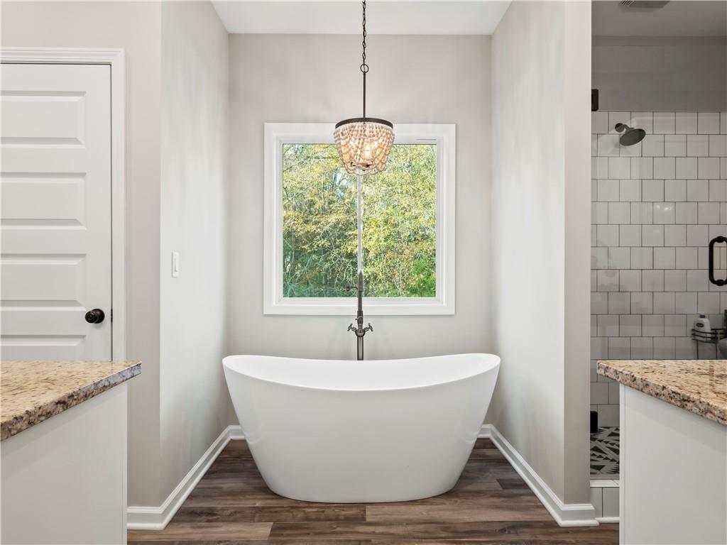 259 Cochran Road Talmo, GA 30575 - Photo 21 of 35 a white bath tub sitting in a bathroom