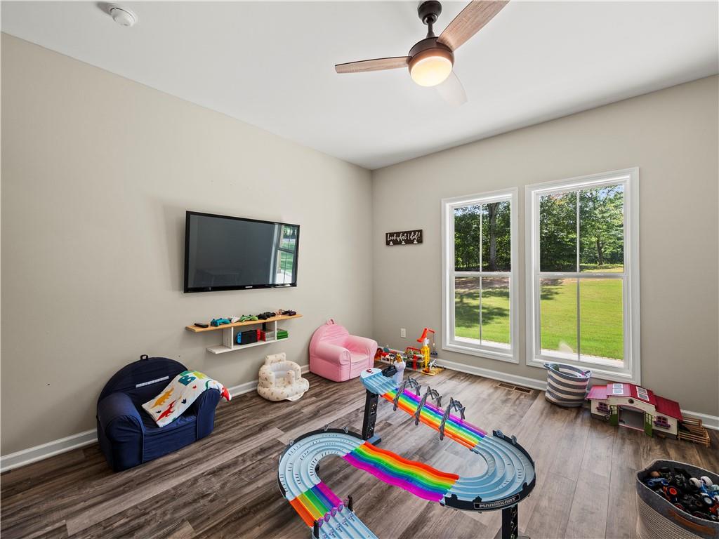 259 Cochran Road Talmo, GA 30575 - Photo 23 of 35 a living room with furniture and a flat screen tv
