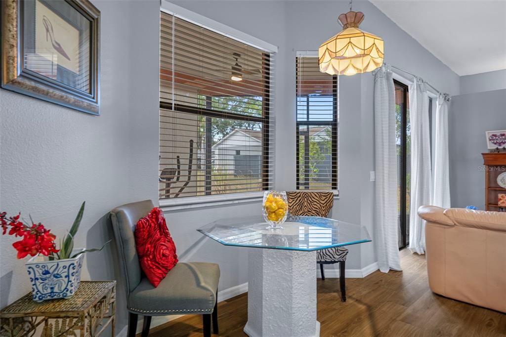 4401 Plumosa Street Spring Hill, FL 34607 - Photo 11 of 38 a view of a dining room with furniture and window