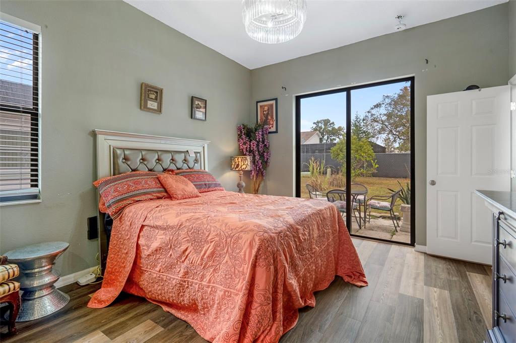 4401 Plumosa Street Spring Hill, FL 34607 - Photo 20 of 38 a bed sitting in a bedroom next to a window