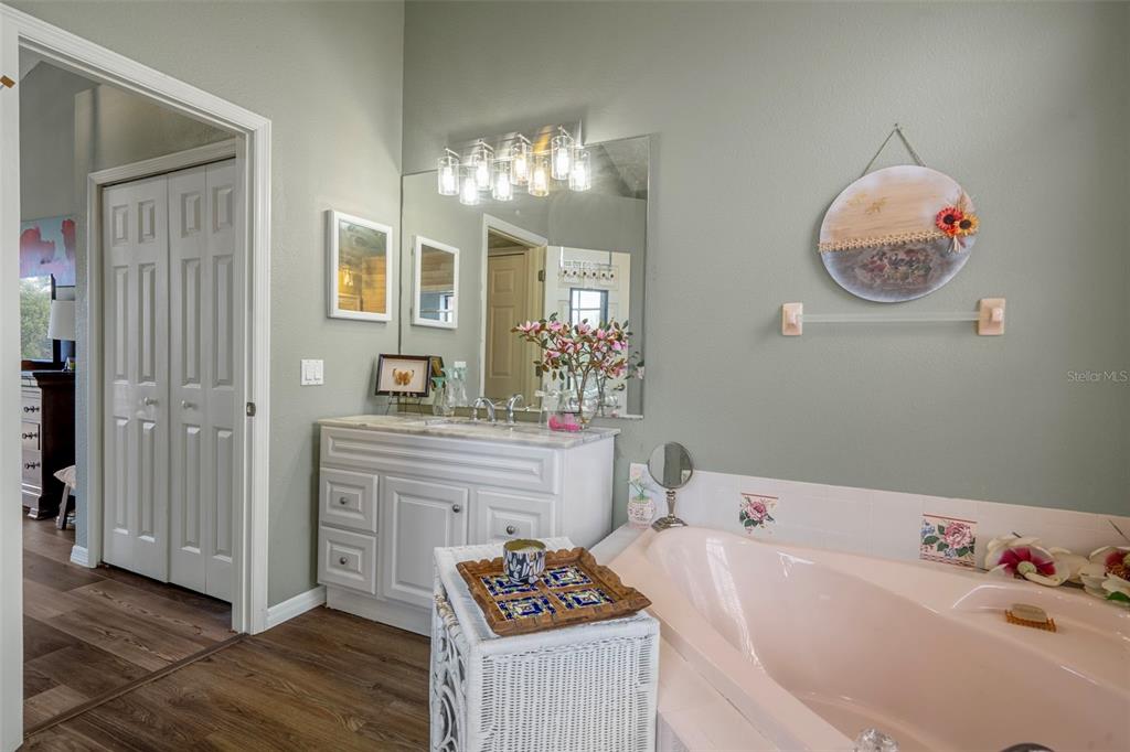 4401 Plumosa Street Spring Hill, FL 34607 - Photo 23 of 38 a bathroom with a sink and a mirror