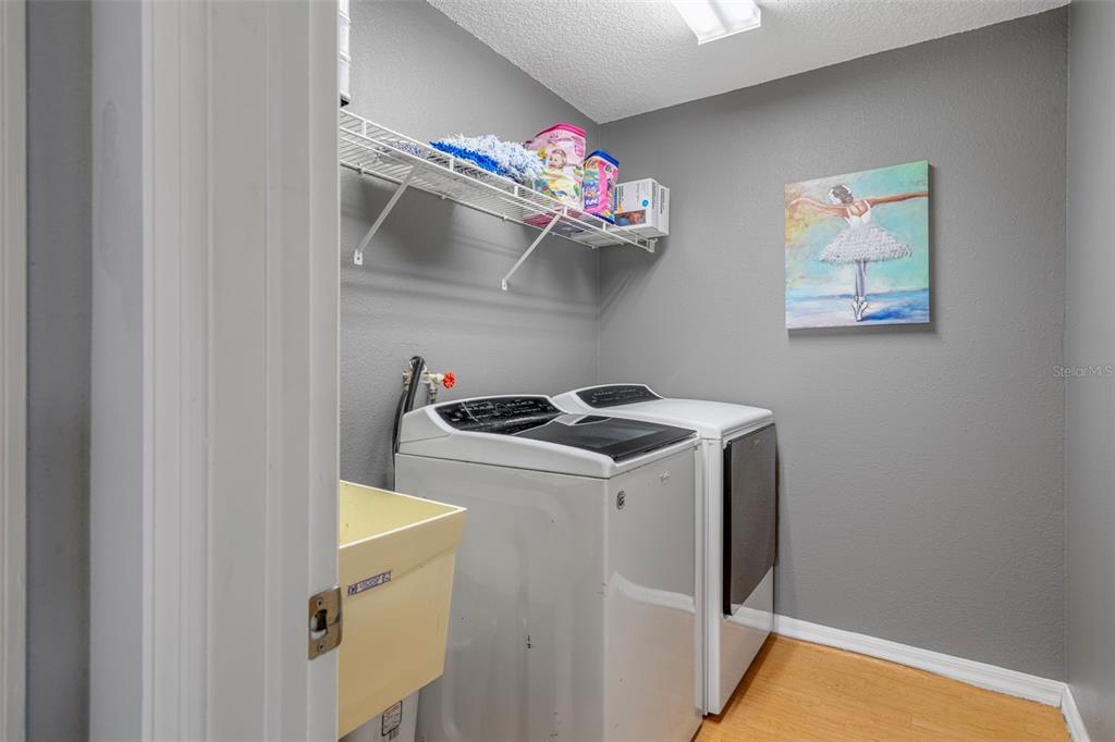 4401 Plumosa Street Spring Hill, FL 34607 - Photo 25 of 38 a utility room with dryer and washer