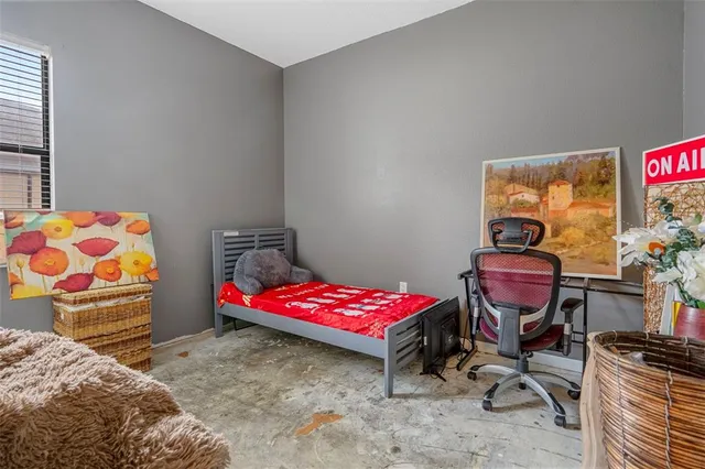 a bedroom with a bed and furniture