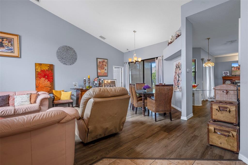 4401 Plumosa Street Spring Hill, FL 34607 - Photo 3 of 38 a living room with furniture and a flat screen tv