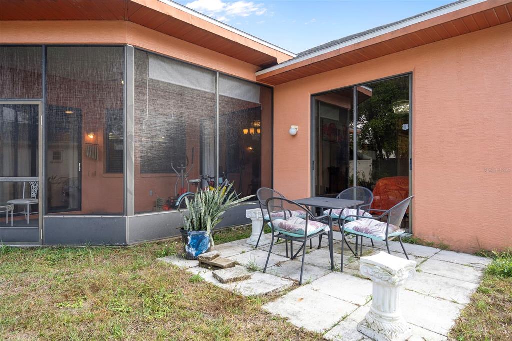 4401 Plumosa Street Spring Hill, FL 34607 - Photo 34 of 38 a view of an chairs and tables in the patio