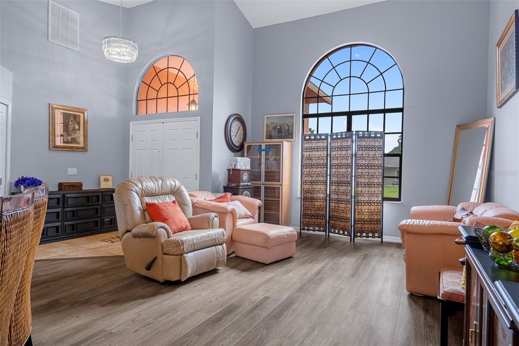 4401 Plumosa Street Spring Hill, FL 34607 - Photo 6 of 38 a living room with furniture and a window