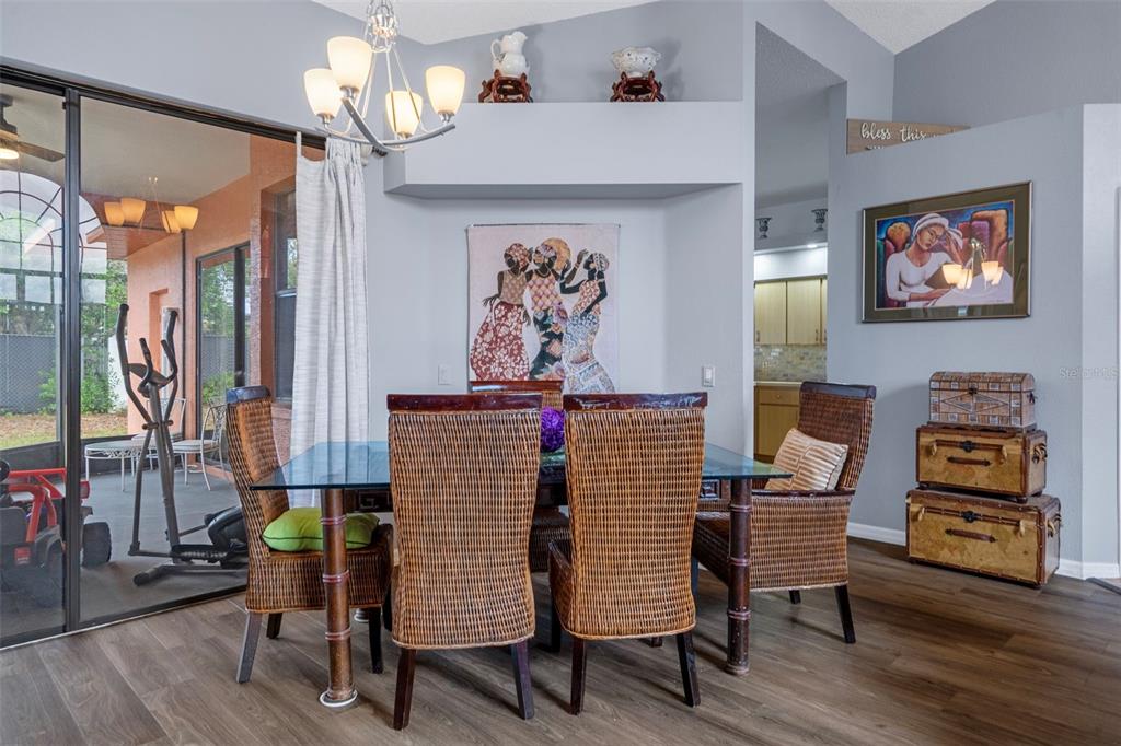 4401 Plumosa Street Spring Hill, FL 34607 - Photo 9 of 38 a living room with furniture and a flat screen tv
