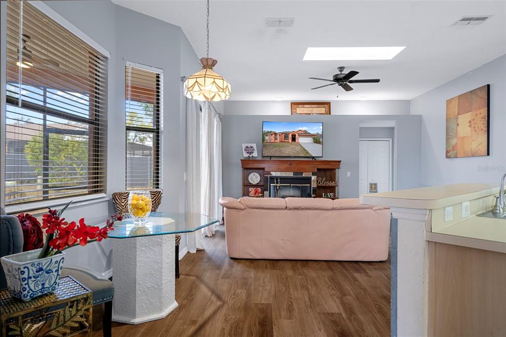4401 Plumosa Street Spring Hill, FL 34607 - Photo 10 of 38 a living room with furniture and a flat screen tv