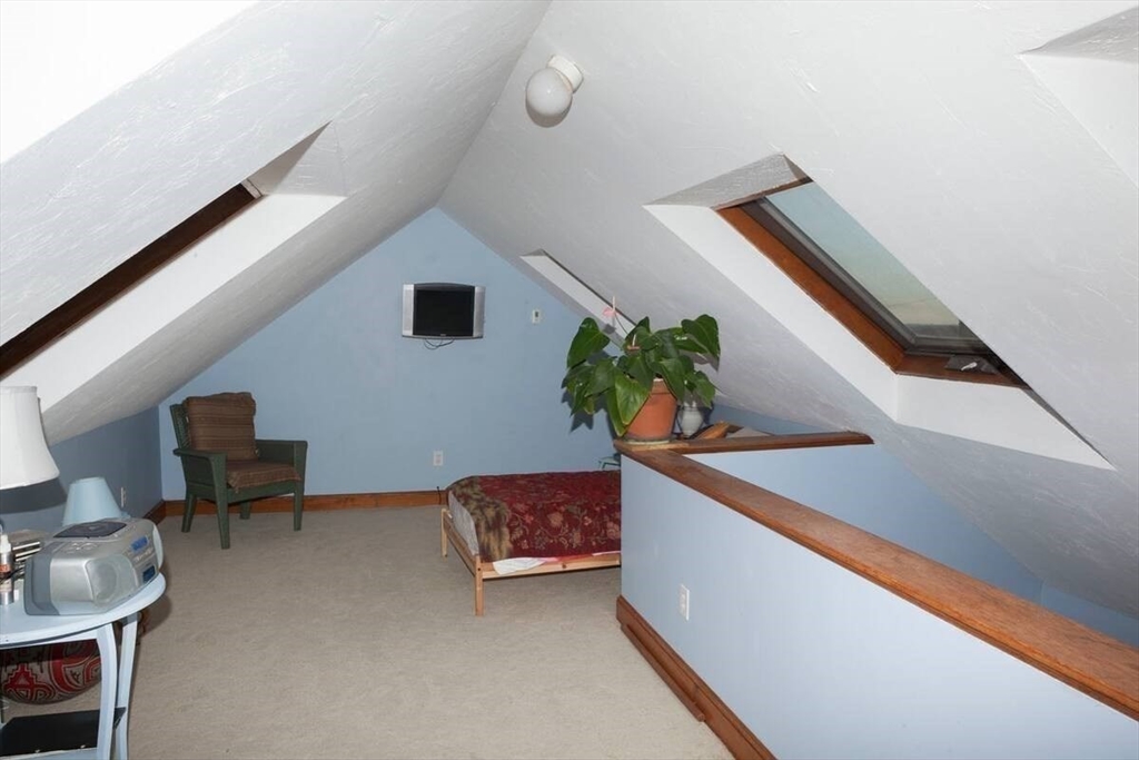 26 Merrill Road, Unit 26 Hull, MA 02045 - Photo 18 of 24 a living room with furniture and a potted plant