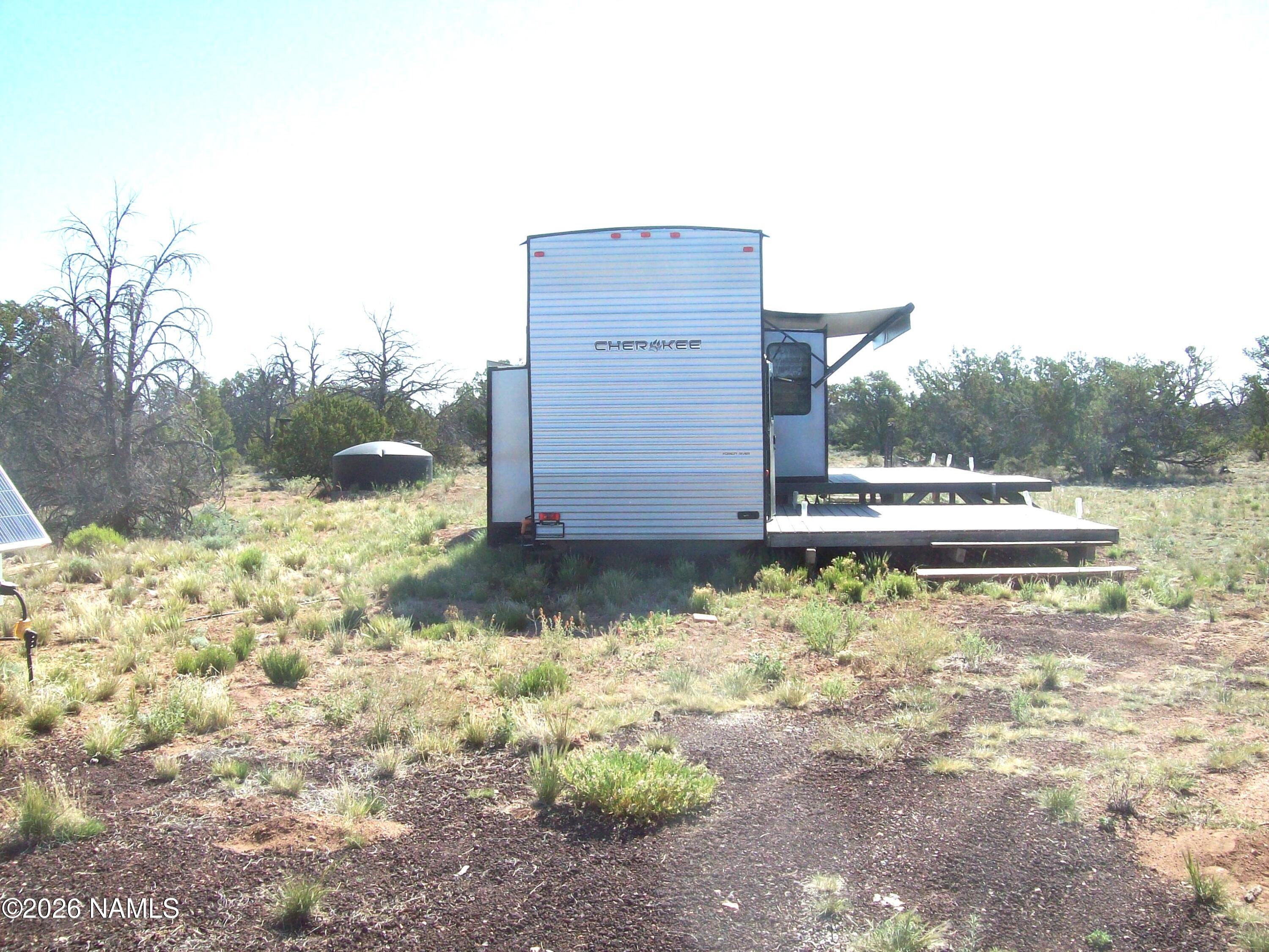 4063 East Woodland Ranch Road Williams, AZ 86046 - Photo 6 of 33 a view of a backyard of the house